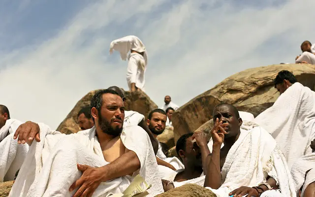 Pilgrims of the Hajj dressed in the white seamless garment (Ihram clothing) praying at the Mount Arafat.