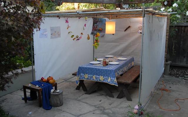 A decorated Sukkah builded in a yard of a family house.