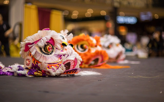 Dragon masks lying on the ground. Disguise elements of the famous «Dragon Dance».