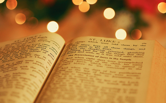 A holy book opened at St. Lukes reference to the Nativity Scene.