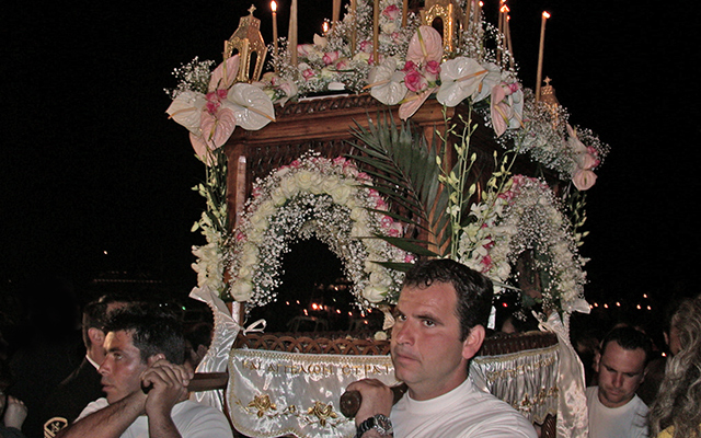 Men carrying the Epitaph (Bier of Christ) during the Great Friday evening procession.