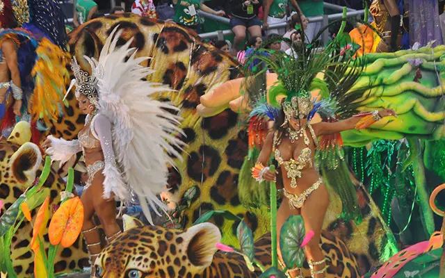 Samba dancers with spectacular costumes on a Carnival float.