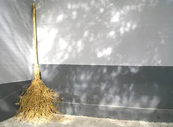 A wicker broom for house cleaning.