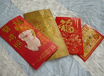 Four Chinese New Year lucky envelopes.