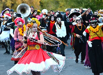 Disguised people at Day of the Dead parade.