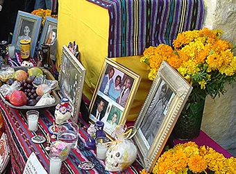 Photographs of the deceased on an altar.