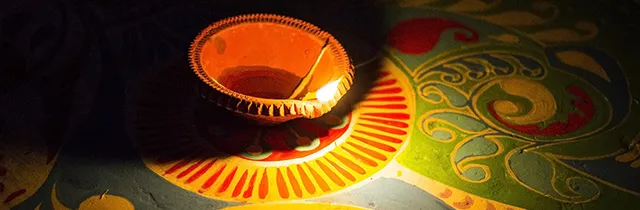 A diya, the typical oil lamp tha illuminates the environment during the festival of Diwali.