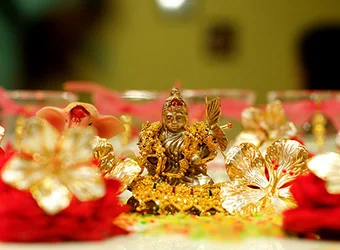 An idol of Devi Lakshmi and various ornaments.