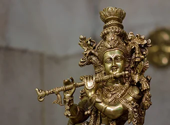 A golden idol of Lord Krishna.