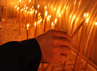 Lit candles offered in an Orthodox church.