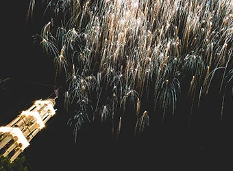 Fireworks by the belfry of an Orthodox church.
