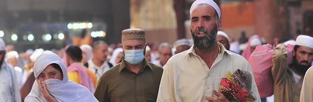 A couple of pilgrims among the crowd during Hajj.