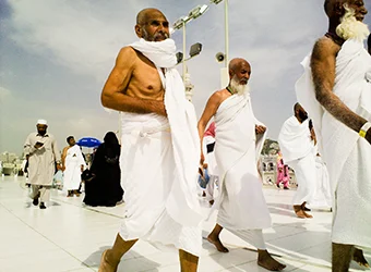 Pilgrims dressed in the white garment (Ihram).