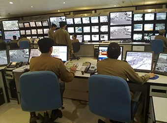 Saudi officers in CCTV control center.