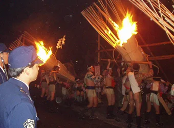 Big fire torches carried by the parade members.