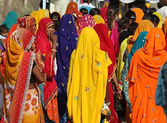 Indian women dressed in colorful garments.