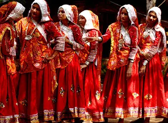 Women in traditional red dresses.