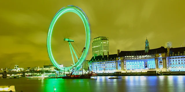 The London Eye illuminated in green during the Saint Patrick's Day celebration.