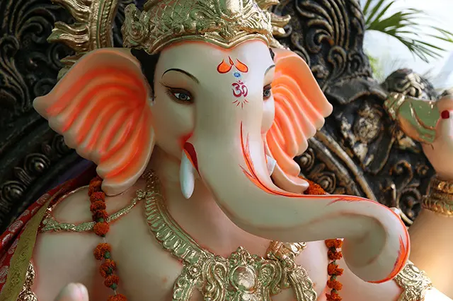 A close up picture showing the details of an idol of Ganesha.