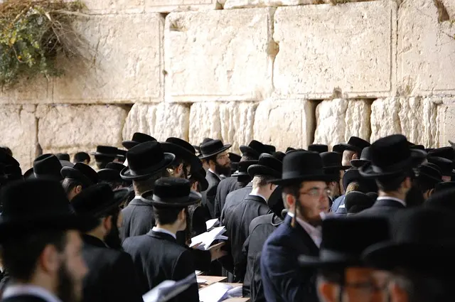Traditionally dressed Jewish believers in the Western Wall of Jerusalem.