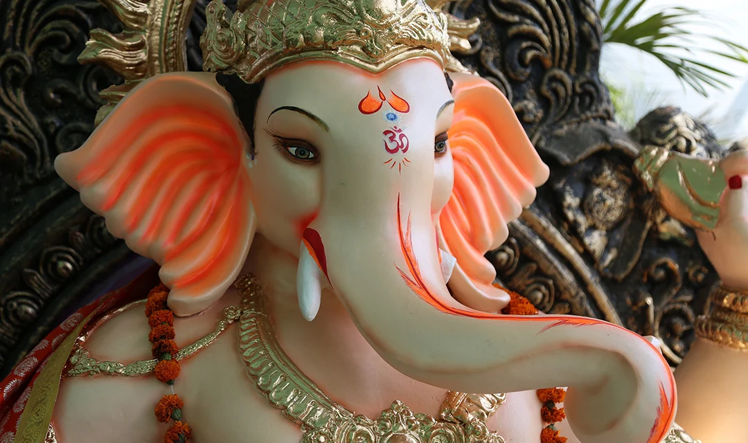 A close up picture showing the details of an idol of Ganesha.