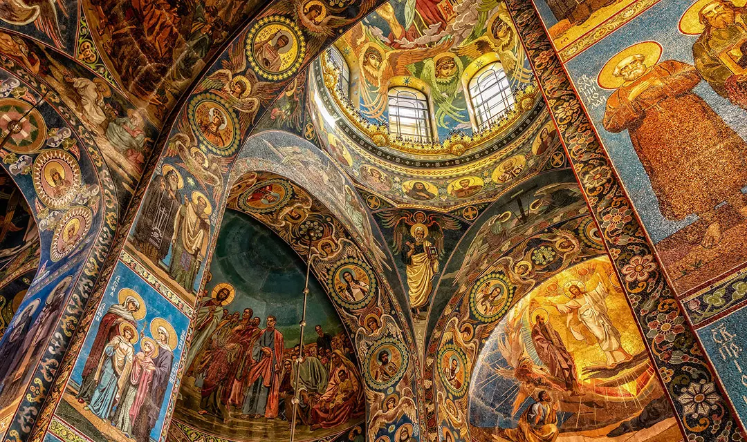 Religious oil paintings on the walls of a Greek Orthodox Church.