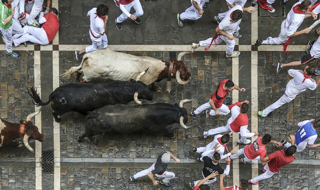 An aerial close up of the El Encierro (Running of the Bulls) ritual.